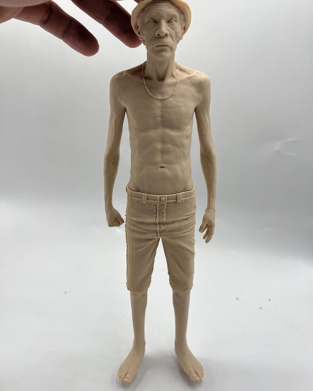 Collector figure, raw cast